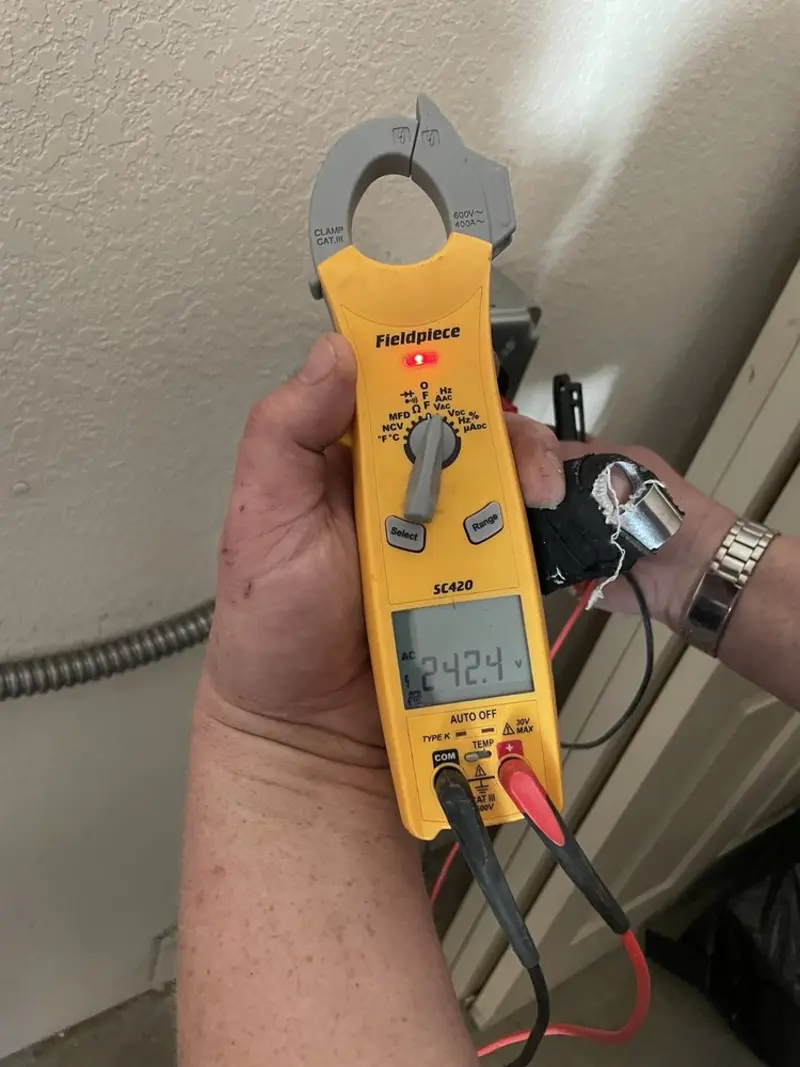 Voltage testing with clamp meter during Aluminum Wiring Replacement in Albion